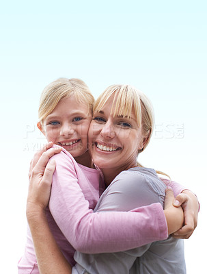 Buy stock photo Portrait, embrace and mother with daughter outside for bonding, happiness and care on blue sky. Smile, love and outdoor hug, mom and kid together with trust, support and gratitude on mothers day.