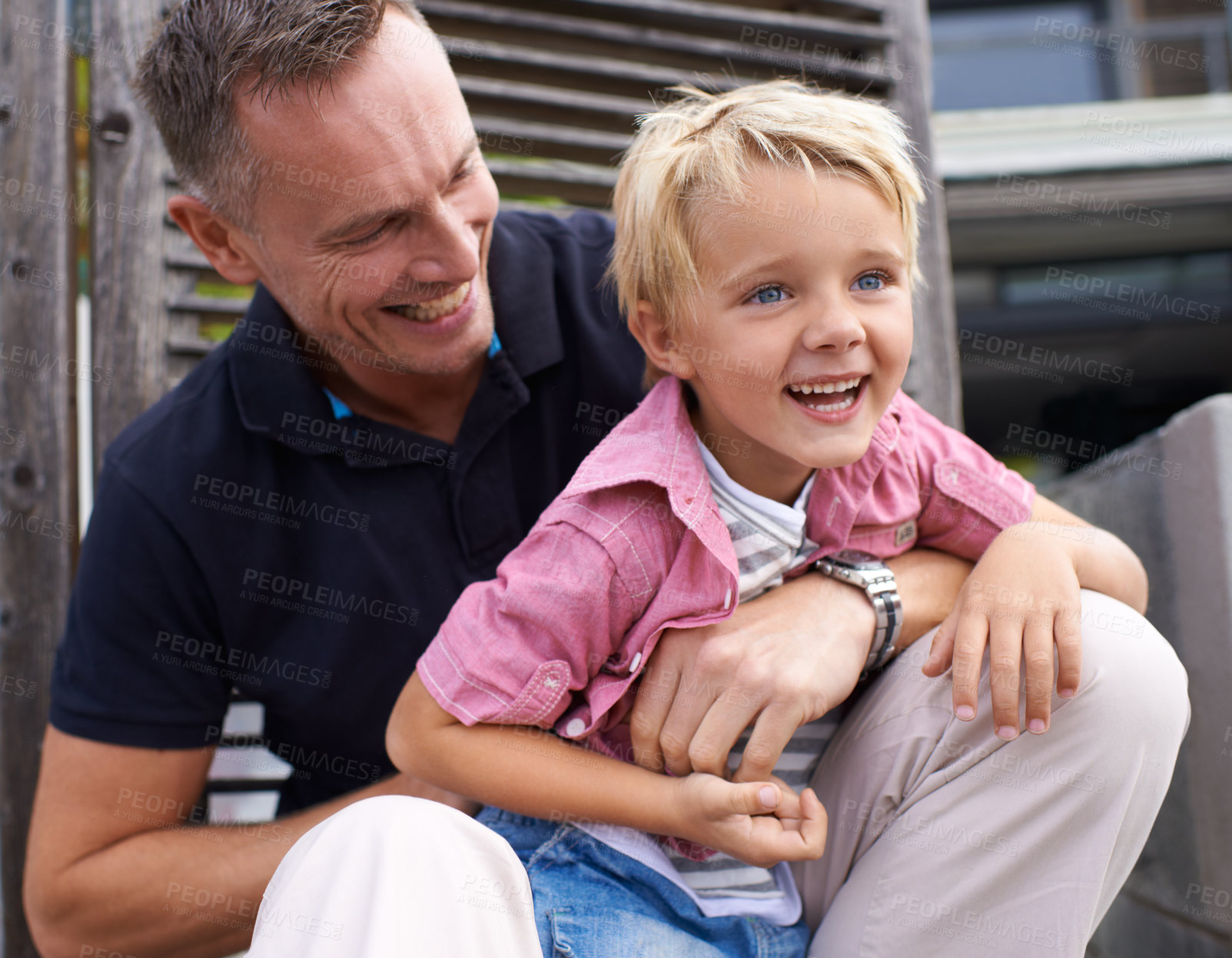 Buy stock photo Father, son are laughing together and family outdoor, love and happiness with young child and parent having fun. Playful, joke or comedy with man and little boy, parenting and childhood with hug