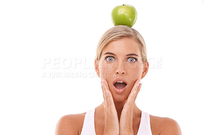 Buy stock photo Woman, surprise and apple on head in studio for wellness, nutrition and balance by white background. Isolated model, fruit and wow face portrait for vitamin c, natural diet and healthy organic food