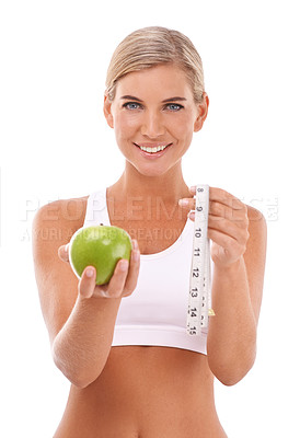 Buy stock photo Woman, studio portrait and apple with measure tape for wellness, diet or happiness by white background. Isolated model, fruit and goal to lose weight with vitamin c, natural nutrition or healthy food