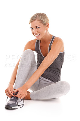 Buy stock photo Fitness, portrait and woman tie shoes for training, smile and workout for wellness, health and girl isolated on white studio background. Female athlete, lady or runner tying sneaker lace and exercise