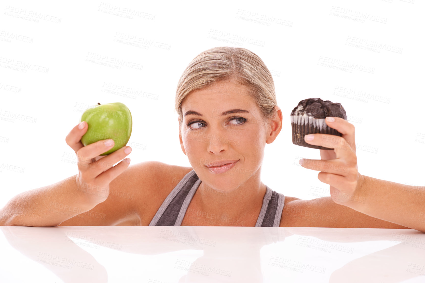 Buy stock photo Woman, decision and choice for cupcake, apple and girl isolated on white studio background. Female lady and healthy lifestyle with dessert, fruit and snack for lunch, eating and thinking on backdrop