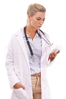 Buy stock photo Woman pharmacist reading medicine table on a white background with focus for pharmaceutical healthcare. Doctor hand holding pills or container thinking of drugs risk or medical brand in studio