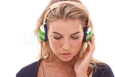 Buy stock photo Music, headphones and face of woman listening to radio, audio podcast or playlist song to relax. Hearing, young studio girl and model streaming sound for stress relief wellness on white background