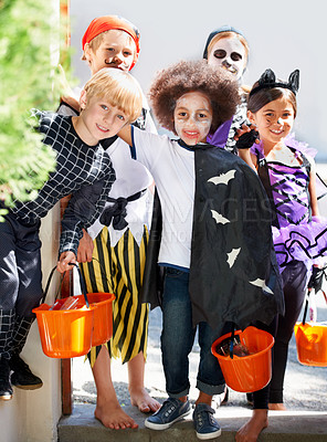 Buy stock photo Portrait, halloween and group of children in costume for trick or treat tradition in neighborhood together. Smile, candy and friends with young kids in fancy dress for holiday or vacation celebration