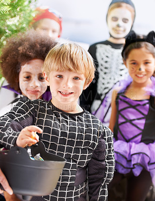 Buy stock photo Portrait, halloween and children friends in costume for trick or treat tradition in neighborhood together. Smile, candy and autumn celebration with group of kids collecting sweets at door of home