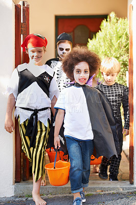 Buy stock photo Portrait, halloween and smile with kids walking in costume for trick or treat celebration together. Children, neighborhood and candy with group of friends on street for holiday or vacation tradition