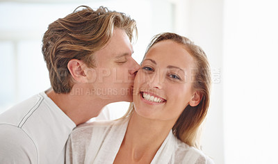 Buy stock photo A happy young couple having an intimate moment in their home