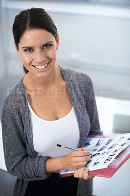 Buy stock photo Portrait, office and designer by contact sheet, happiness and creative professional in career in startup. Young woman, face and smile in job pride, editor and confident employee in photography agency