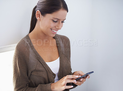 Buy stock photo Phone, news or happy woman in workplace on social media to chat on internet or website notification. Check, smile or female entrepreneur in office texting, networking or typing online on mobile app 