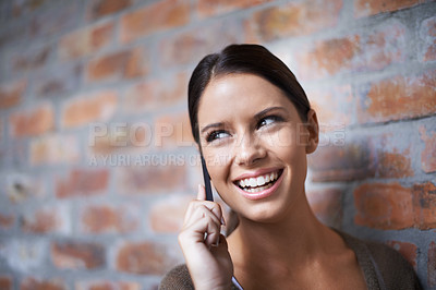 Buy stock photo Phone call, thinking or happy woman by a wall for communication, gossip or chat in office. Talking, smile or face of worker listening in mobile conversation or speaking of news, feedback or new ideas