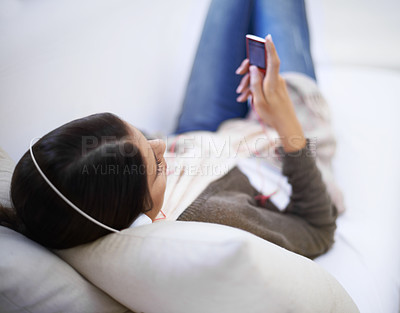 Buy stock photo Top of a woman, home or headphones for music, podcast or radio streaming on online subscription. Break, relax or female person listening with audio player on sofa in lounge for sound, song or track