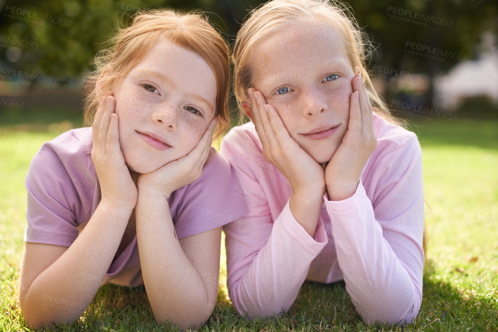 Buy stock photo Portrait, kids or sisters relax in nature for bond, holiday and play together with support or peace. Park, young children or girl siblings on outdoor grass with care, love or friendship in a garden