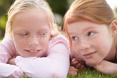 Buy stock photo Grass, happy kids or sisters relax in nature for bond, holiday and play together with support or joy. Park, relax or faces of children siblings in field with smile, love or friendship in a garden