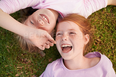 Buy stock photo Grass, happy kids or sisters laughing in park for bond, holiday or play together for support or joy. Top view, relax or funny children siblings in field with smile, love or friendship in a garden