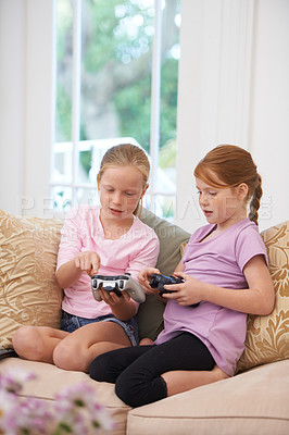 Buy stock photo Teaching, joystick or kids gaming to play online with controller on couch or sofa in living room. Children, learning experience or young girl gamers explaining video games for contest on technology