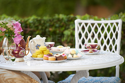 Buy stock photo A table decked out with tasty treats and tea