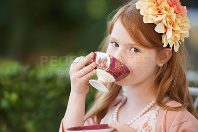 Buy stock photo Girl, child and portrait of drinking tea in garden with party for birthday, celebration and playing outdoor. Person, kid and porcelain cup in backyard with dress up, beverage and role play with fun