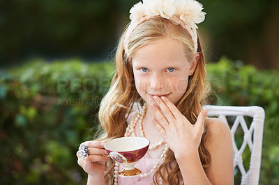 Buy stock photo Children, tea party and portrait of girl in a garden for playing, fun and fantasy outdoor. Hands, face and kid relax in a backyard with elegant, fancy or creative celebration, games or birthday theme