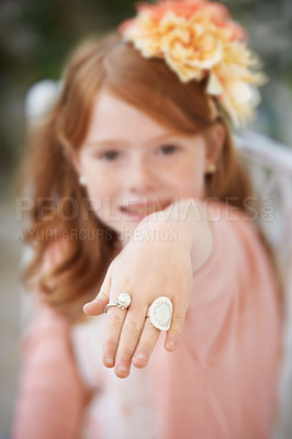 Buy stock photo Girl, child and portrait or hand jewelry or fantasy game play for dress up fancy, birthday party or event. Female person, face and fingers for stylish ring or kid confidence in costume, outfit or fun