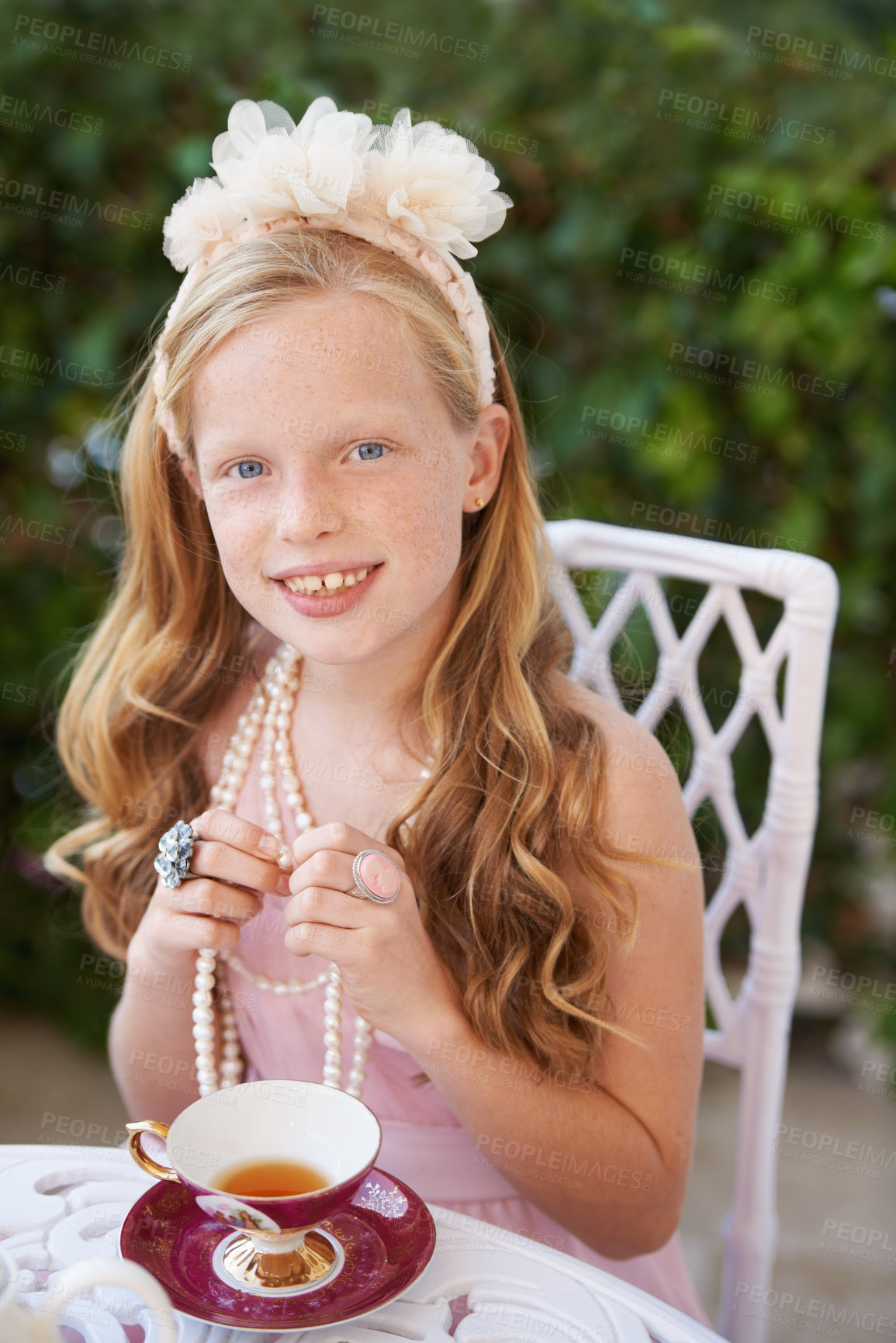 Buy stock photo Tea party, portrait and happy girl in a garden for playing, fun and fantasy outdoor. Children, face and kid smile in a backyard with elegant, fancy or creative celebration, games or birthday theme