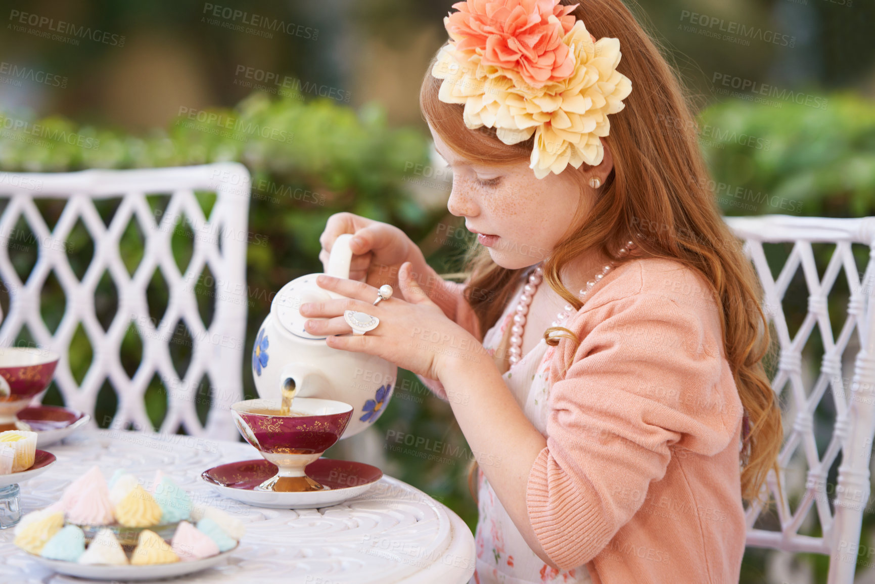 Buy stock photo Girl, child and pouring tea in garden with party for birthday, celebration and playing outdoor in home. Person, kid and porcelain cup in backyard of house with dress up, beverage and role play fun