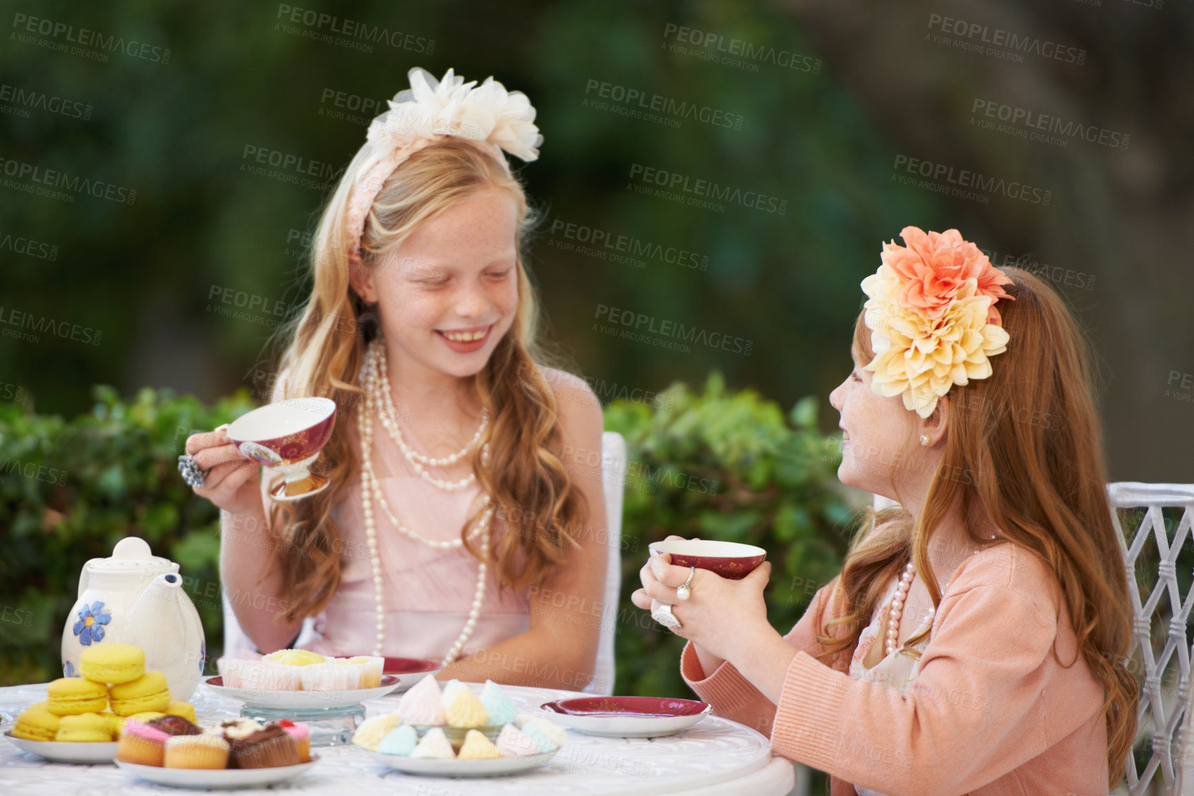 Buy stock photo Tea, party and girl children are happy outdoor, playing with fine china for celebration and fun in backyard. Relax, spring and kids in garden together, friends with beverage or drink for bonding