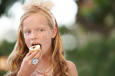 Buy stock photo Child, girl and eating cupcake or garden for birthday food or celebration, dessert or candy. Female person, happy kid and  bite sweet snack at outdoor event for hungry joy or treat meal, party or fun