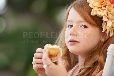 Buy stock photo Child, girl and eating cupcake or sweets outdoor for birthday food or celebration, dessert or candy. Female person, happy kid and sweet snack at garden event for hungry for treat meal, party or fun