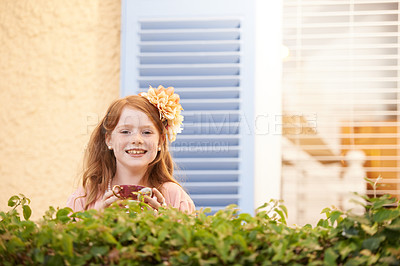 Buy stock photo Girl, child and portrait in garden with tea party for fun, celebration and playing outdoor in spring. Person, kid and face with happiness in backyard of home or apartment with cup and flower in hair 