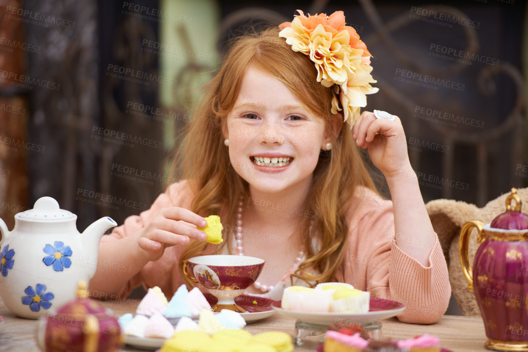 Buy stock photo A cute red headed girl playing dress up and having a tea party