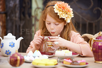 Buy stock photo Girl, child and drinking tea in garden with party for birthday, celebration and playing outdoor in home. Person, kid and porcelain cup in backyard of house with dress up, beverage and role play fun