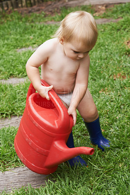 Buy stock photo Baby, garden and boy with a water can, nature and playing with fun, happiness and summer. Grass, child development and kid with a toy, environment and liquid for grass, break and learning with growth
