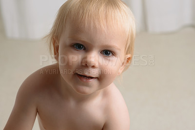 Buy stock photo Happy baby, portrait and blonde boy in growth, youth or development in living room at home. Closeup of cute, adorable or little toddler, kid or child smile in happiness innocent or positive attitude