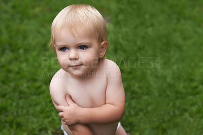 Buy stock photo Baby, standing and nature on grass, development and growth for curiosity, backyard and home. Toddler, child and face in garden, alone and childhood memories for wellness, outdoor and exploring