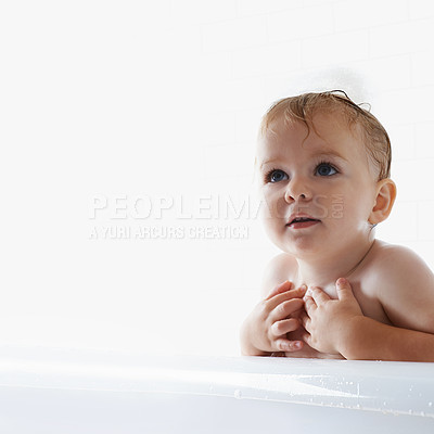 Buy stock photo Face of baby in bath, clean skin with mockup in morning routine for health, wellness and body care in home. Cute toddler washing in water with hygiene, relax and calm child sitting in tub in bathroom