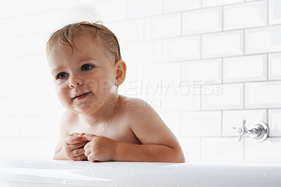 Buy stock photo Face of baby in bathtub, clean skin and smile in morning routine for health, wellness and body care in home. Cute toddler washing in bath with hygiene, relax and calm child sitting in tub in bathroom