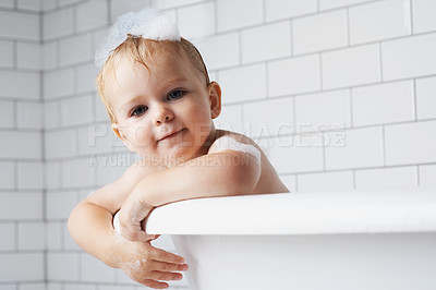 Buy stock photo Portrait of an adorable baby boy standing in the bath tub