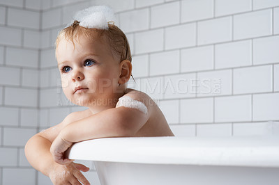 Buy stock photo Boy, baby and child in bath of bubbles, tub and cleaning with water for skincare, morning routine and wellness at home. Toddler kid, thinking and washing hair with soap, foam and hygiene in bathroom