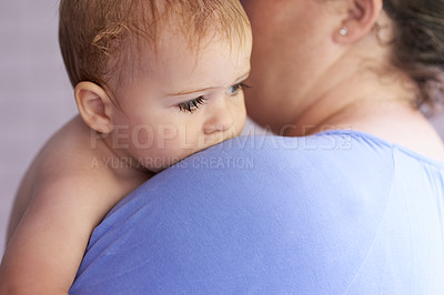 Buy stock photo Mom, comfort and holding baby with calm, sleepy or tired in home with support and care. Mother, love and carry child in arms bonding with kindness in bedroom and infant with trust in mama and family