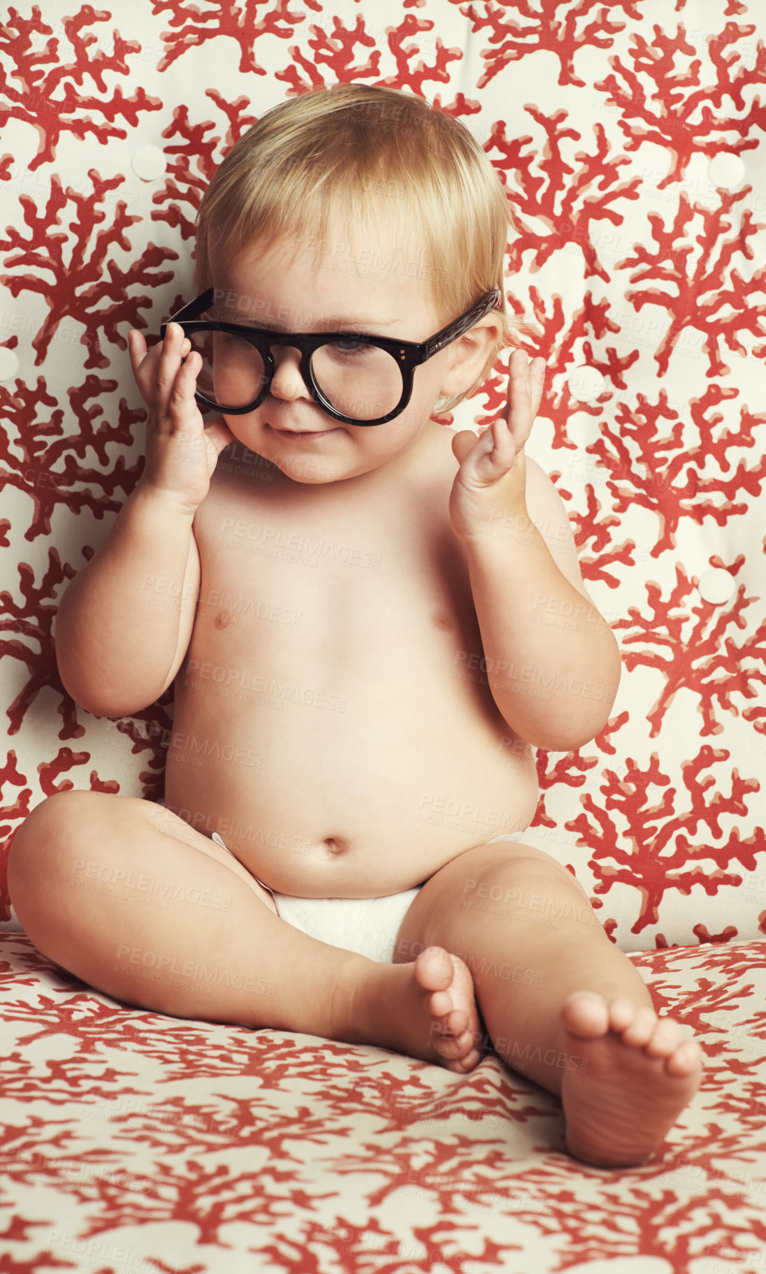 Buy stock photo Smile, glasses and fun baby in studio with vision, eye care and health for child development. Happy, cute and young infant, toddler or kid playing with spectacles or eyewear by wallpaper background.