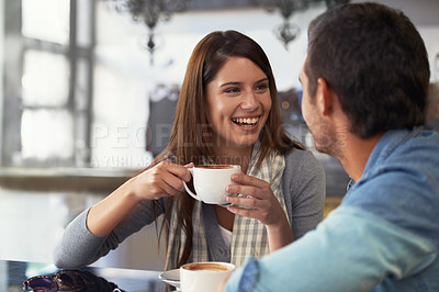 Buy stock photo Love, smile and couple drinking coffee in cafe, care and bonding together on valentines day date. Happy man, woman in restaurant and tea for connection, conversation and healthy relationship in shop