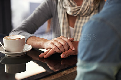 Buy stock photo Cropped shot of a couple in a coffee shop