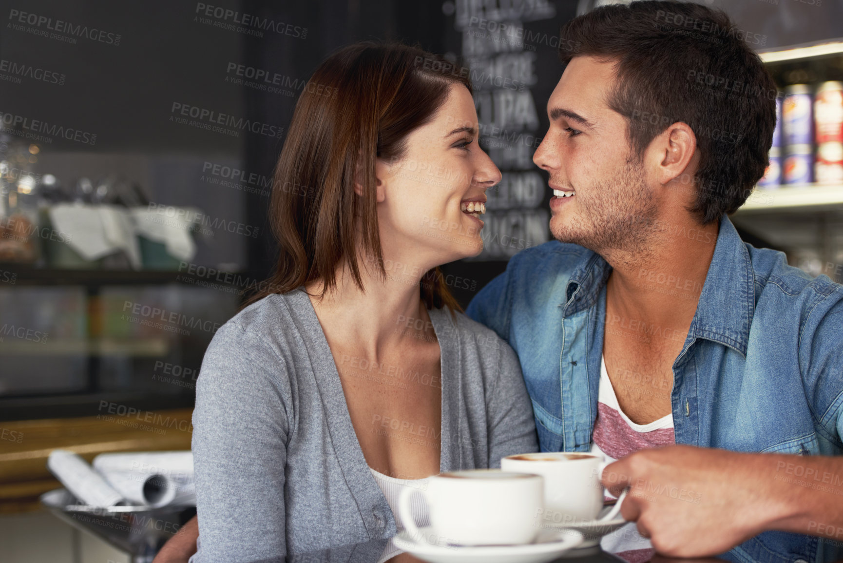 Buy stock photo Smile, shop and couple drinking coffee in cafe, care and bonding together on valentines day date. Happy, man and woman in restaurant with latte for love connection, conversation and relationship