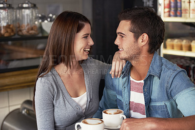 Buy stock photo Love, conversation and happy couple in cafe, drinking coffee and bonding together on valentines day date. Smile, man and woman in restaurant with latte for chat, laughing and relationship in shop