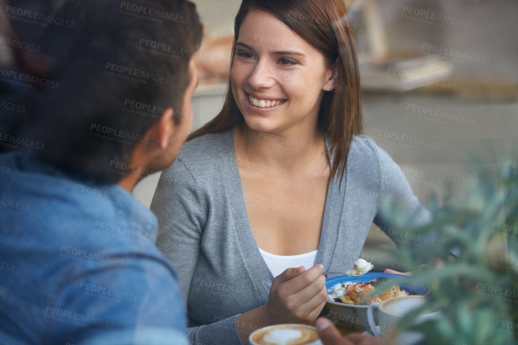 Buy stock photo Love, happy couple eating in coffee shop and drink in cafe for bonding together on valentines day date in the morning. Smile, man and woman in restaurant with breakfast espresso, food or conversation
