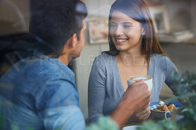 Buy stock photo Relax woman, happy and couple on coffee shop date, lunch break or enjoy diner conversation, chat or eye contact. Relationship partner, restaurant window and girlfriend talking with boyfriend in cafe