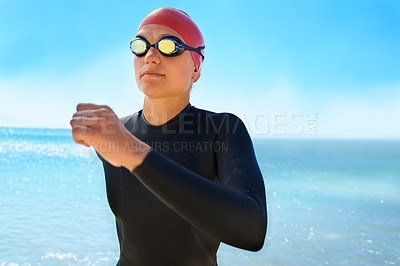 Buy stock photo Fitness, goggles and woman swimming at the beach with blue sky for triathlon, race or competition training. Female Swimmer, athlete or person in ocean or sea for sports workout or exercise for health