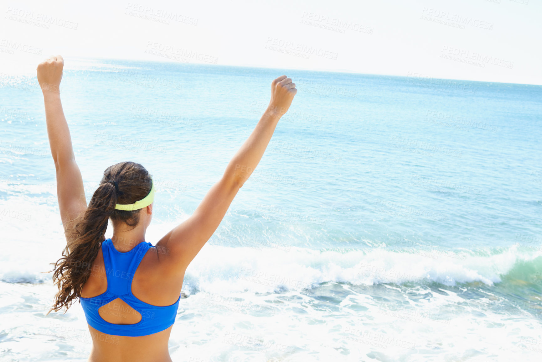 Buy stock photo Celebration, winner and back of woman on beach cheering to the ocean for freedom and happiness. Excited, water and female person with fist success or triumph expression by sea for achievement.