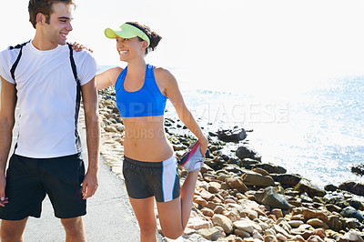Buy stock photo Couple, outdoor and stretching in beach, workout and fitness with smile, training and sunrise for run. Man, woman and athletic for ocean, sea and exercise together in summer, boyfriend and girlfriend